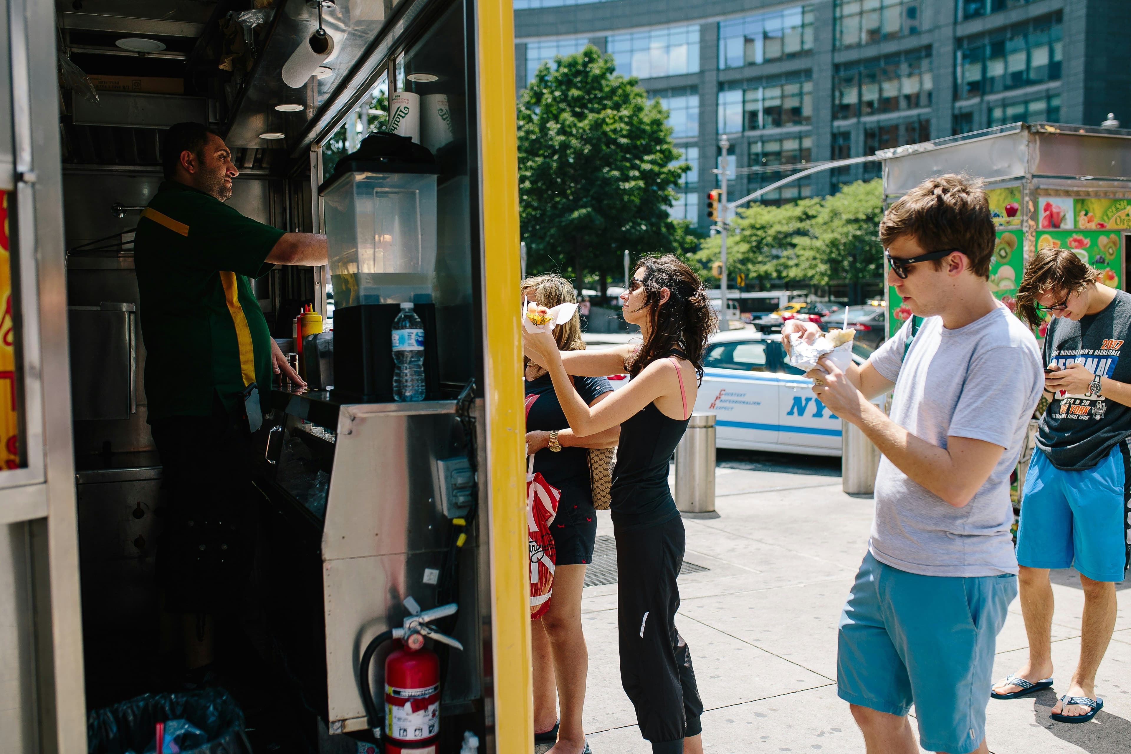 People queing for a food cart